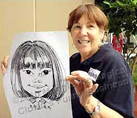 Photo of artist holding caricature
