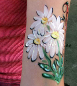 Facepaint of flowers on an arm