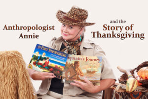 Anthropologist Annie holding 2 storybooks